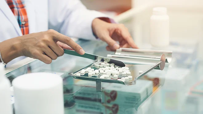 pharmacist sorting pills