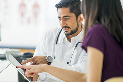 Doctor with Patient on Patient Portal